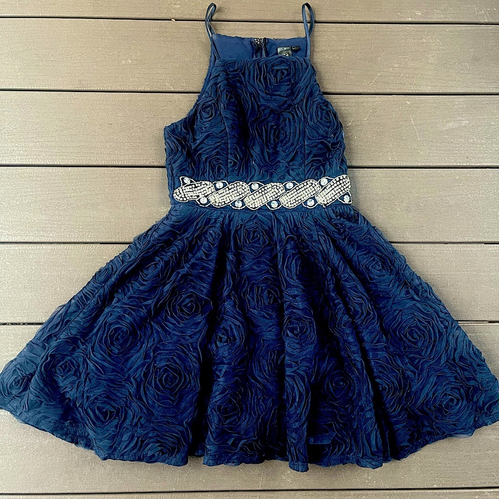 navy blue homecoming dress. floral detailing with a studded belt